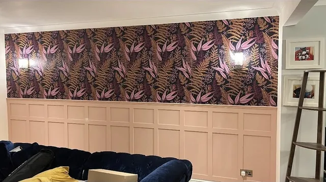 Botanical feature wallpaper above blush-pink wall panelling