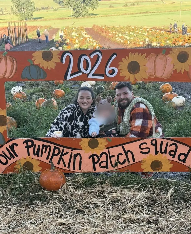 John with his family at a pumpkin patch